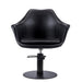 Front view of the Karma Cronulla salon chair in black vinyl with a modern sculptural design