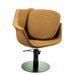 Angled view of the Karma Cronulla salon chair in tan upholstery featuring a comfortable seat cushion