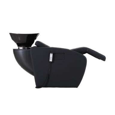 Side profile of the Karma Daylesford massage shampoo basin unit showing the fully reclined leg rest and black vinyl finish