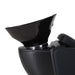 Detailed view of the ergonomic neck groove and tilting mechanism on a professional salon shampoo basin