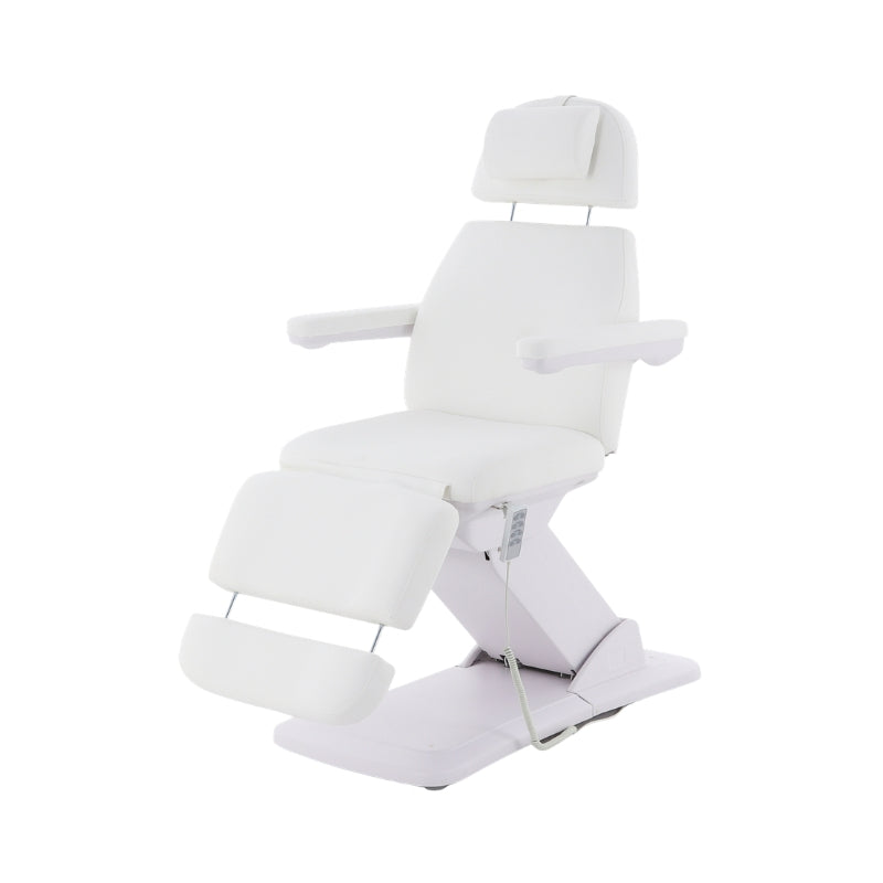 White Karma Dunedin electric beauty bed with padded headrest cushion and adjustable height