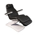 Angled view of the black Karma Dunedin electric treatment table showing the adjustable leg and back sections