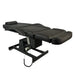 Black Karma Hamilton electric beauty bed adjusted to a fully flat position for treatments