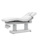 Side profile of the beauty bed highlighting the integrated paper roll holder for sanitary treatment setup