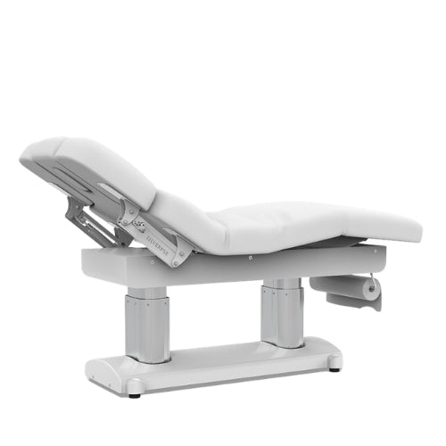 Professional electric beauty bed with the backrest inclined for client comfort during consultations