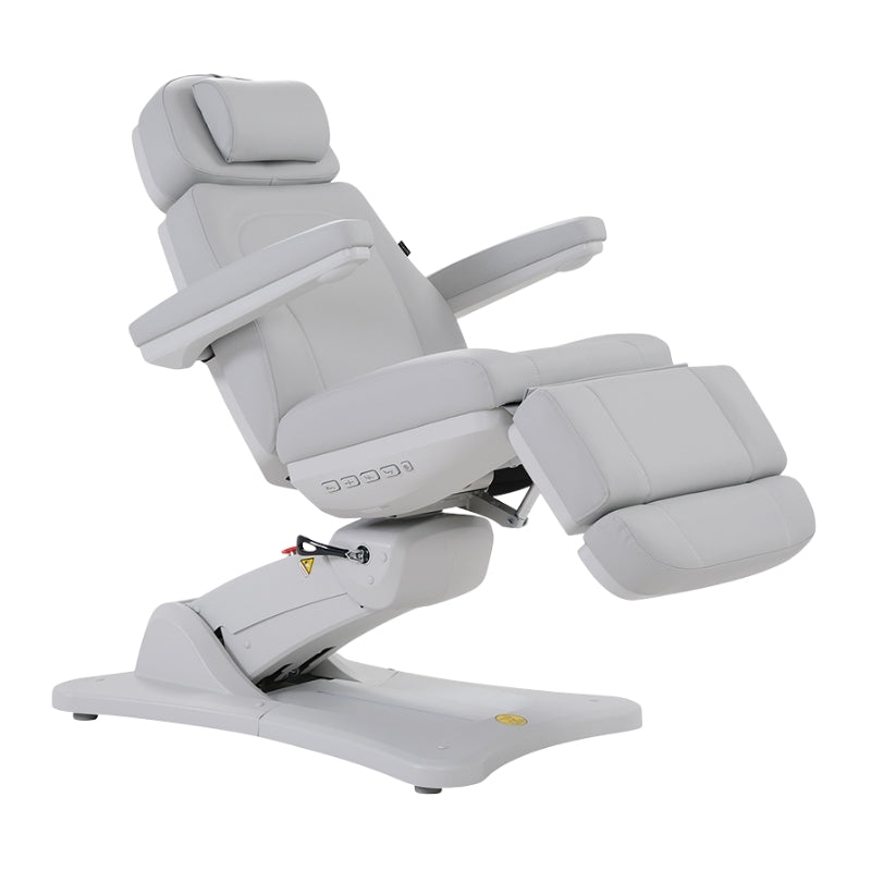 White Karma Inglewood beauty bed in a semi-reclined position for facial and aesthetic treatments