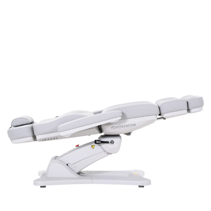 Karma Inglewood full electric beauty bed in white shown in a fully flat horizontal position