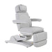 Karma Inglewood medical treatment table in white adjusted to an upright chair position with armrests