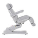 Side view of the Karma Inglewood treatment bed showing the electric tilt and leg rest adjustment