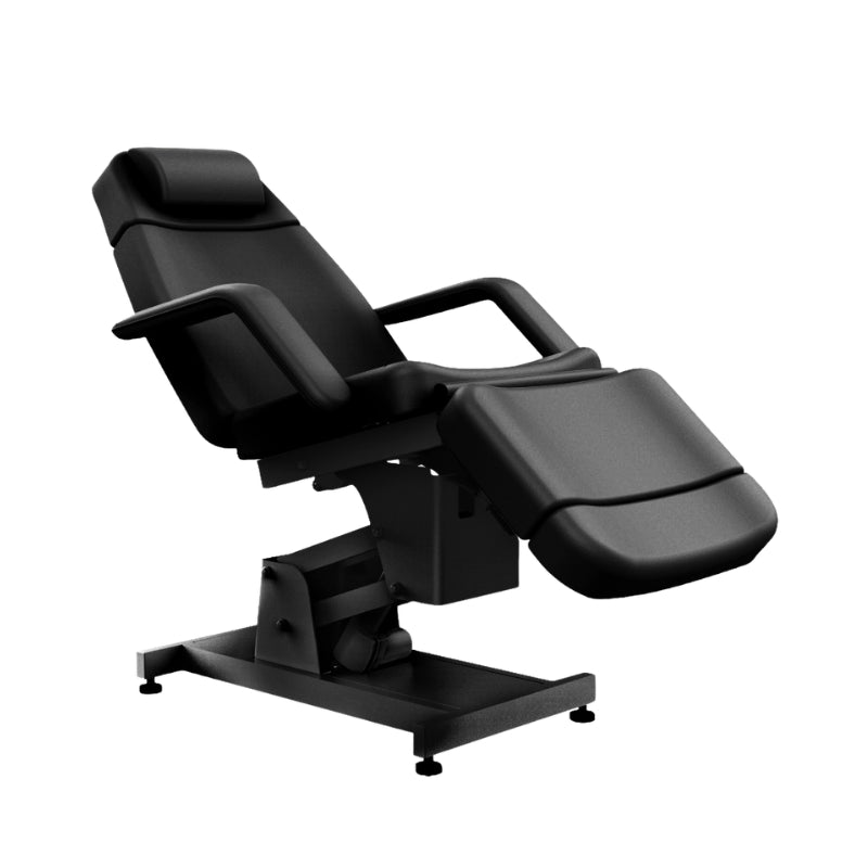Side profile of the black Karma Invercargill electric beauty bed showing the four motor base