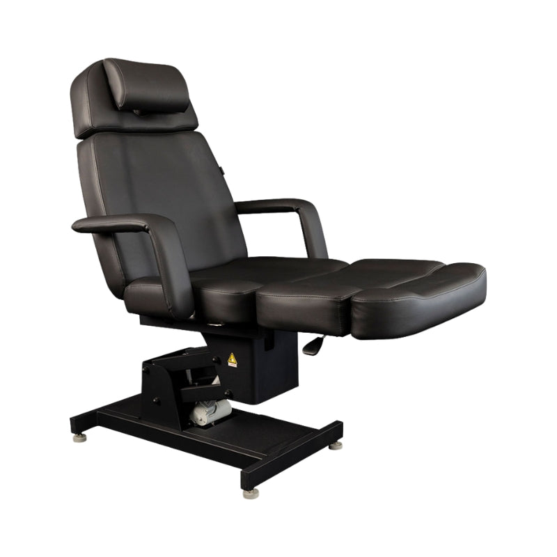 Karma Invercargill black electric beauty bed in upright seated position for salon treatments