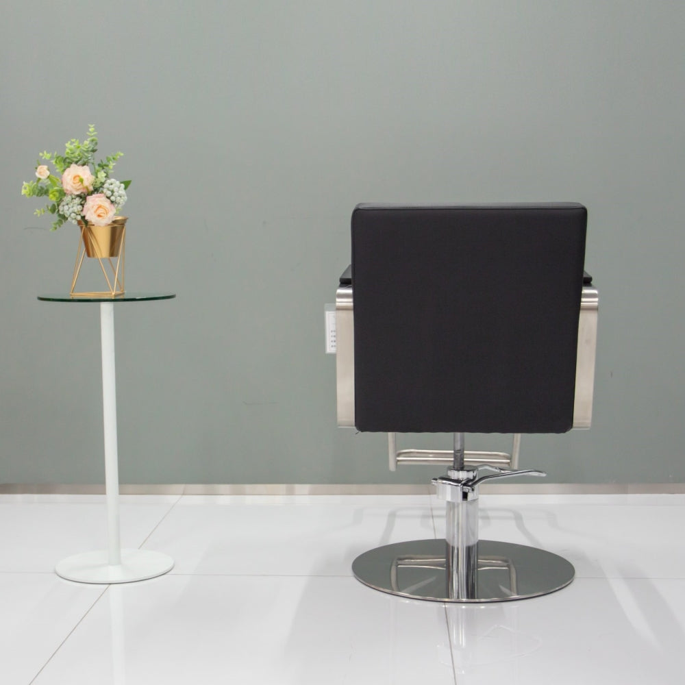 Rear view of the Karma Lithgow hair salon chair showing the sleek upholstered back and chrome finish