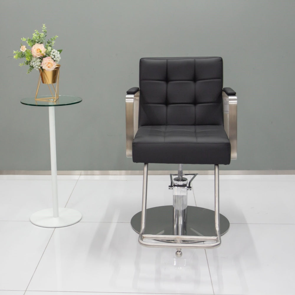 Front view of the Karma Lithgow styling chair showing the tufted backrest and internal seat width
