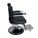 Side profile of the Karma Mt Isa barber chair showing the heavy duty hydraulic pump and footrest