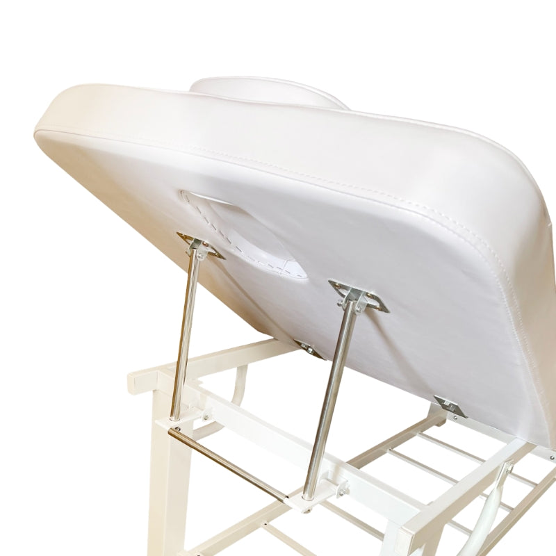 Underside view of the adjustable backrest mechanism and sturdy frame of the white beauty bed