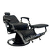 Side angle of the all black Karma Noosa barber chair showing the patterned metalwork