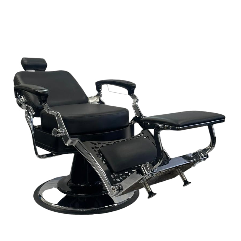 Side angle of the all black Karma Noosa barber chair showing the patterned metalwork
