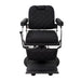 Front view of black professional barber chair showing padded armrests and footrest
