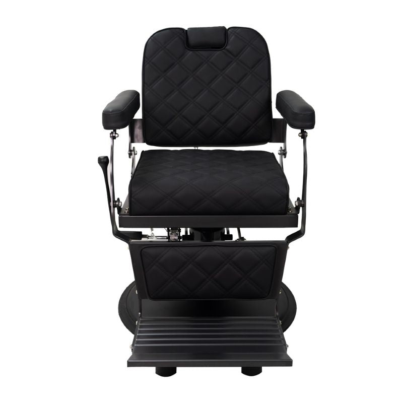 Front view of black professional barber chair showing padded armrests and footrest