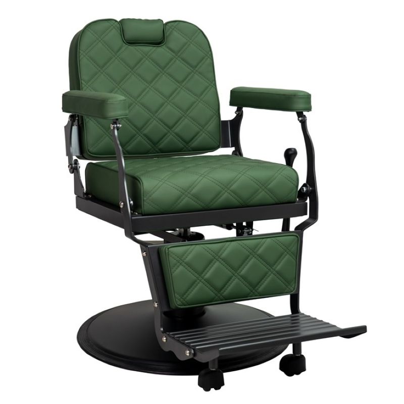 Side angle of forest green barber chair showing padded armrests