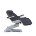 Charcoal and white electric beauty bed with illuminated LED pedestal base