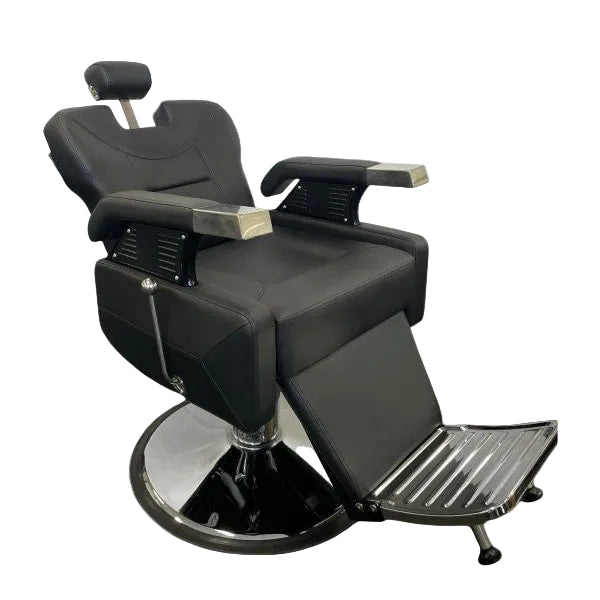 Side view of the Karma Runcorn barber chair showing the reclining mechanism and footrest extension