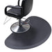 Close up of the Karma hairdressing mat showing the semi-circle cutout designed for round base salon chairs