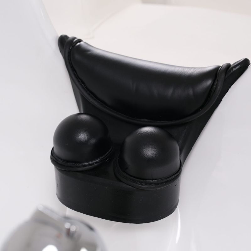 Adjustable headrest detail on professional electric shampoo unit