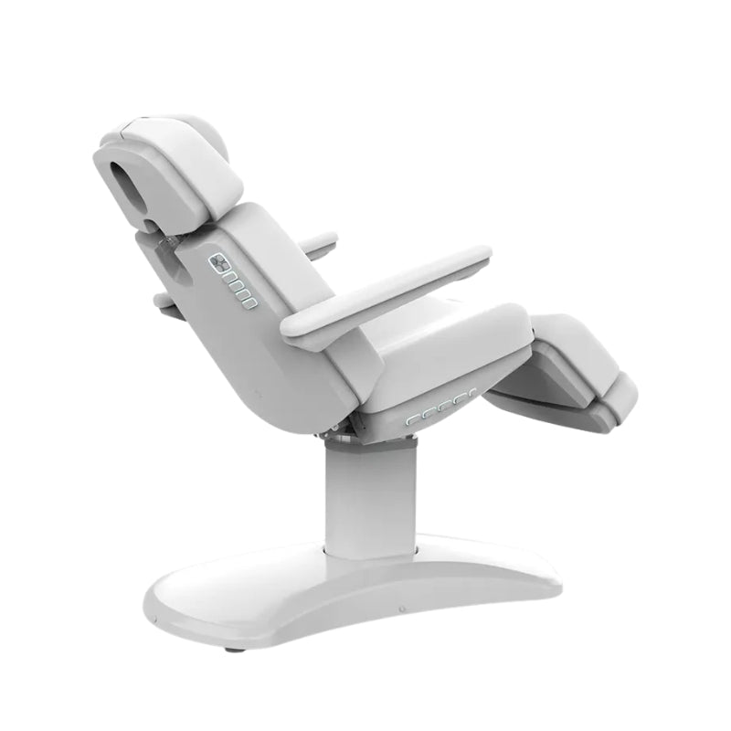 Karma Stratford electric treatment table showing adjustable leg and backrest sections for patient comfort