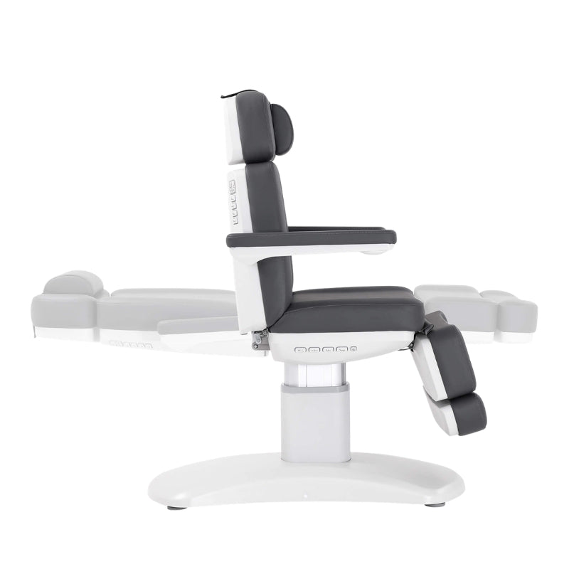 Karma Stratford beauty bed in a vertical sitting position with grey cushions and adjustable armrests