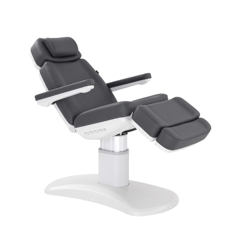 Karma Stratford electric treatment table featuring charcoal grey upholstery and white column base