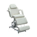 Front view of the white Karma Taupo beauty bed showing the hydraulic foot pump and adjustable sections