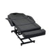 Angled view of the black Karma Taupo beauty bed with adjustable leg and back sections
