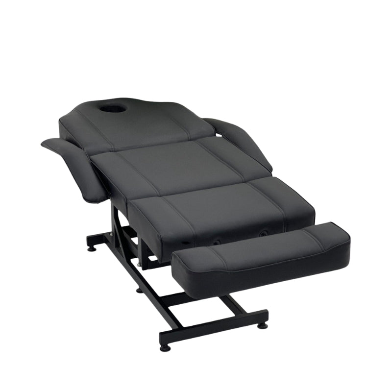 Angled view of the black Karma Taupo beauty bed with adjustable leg and back sections