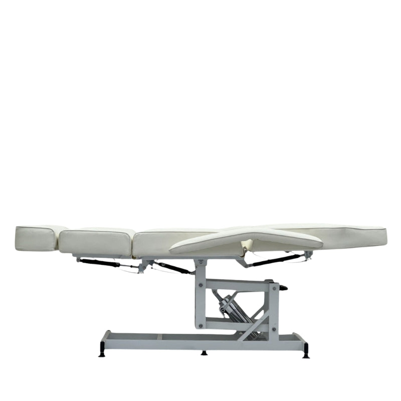 Karma Taupo white hydraulic beauty bed in a flat position for skin clinics and spas