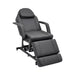 Black Karma Taupo hydraulic treatment chair in an upright seated position with armrests