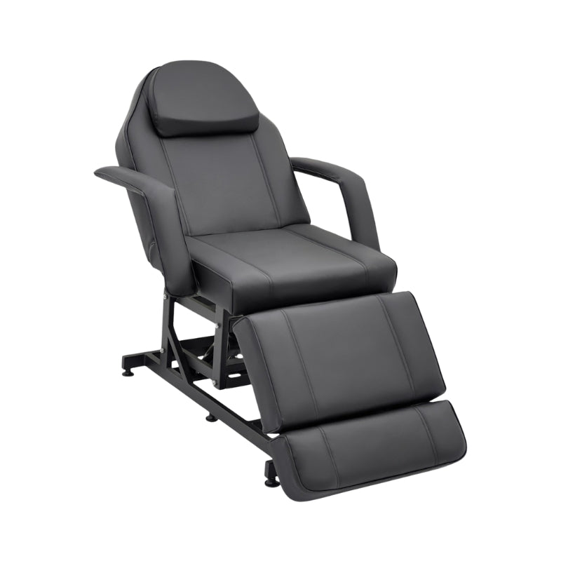 Black Karma Taupo hydraulic treatment chair in an upright seated position with armrests