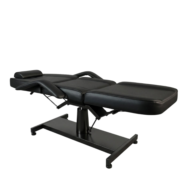 Professional black hydraulic tattoo bed in flat position with face hole and removable pillow