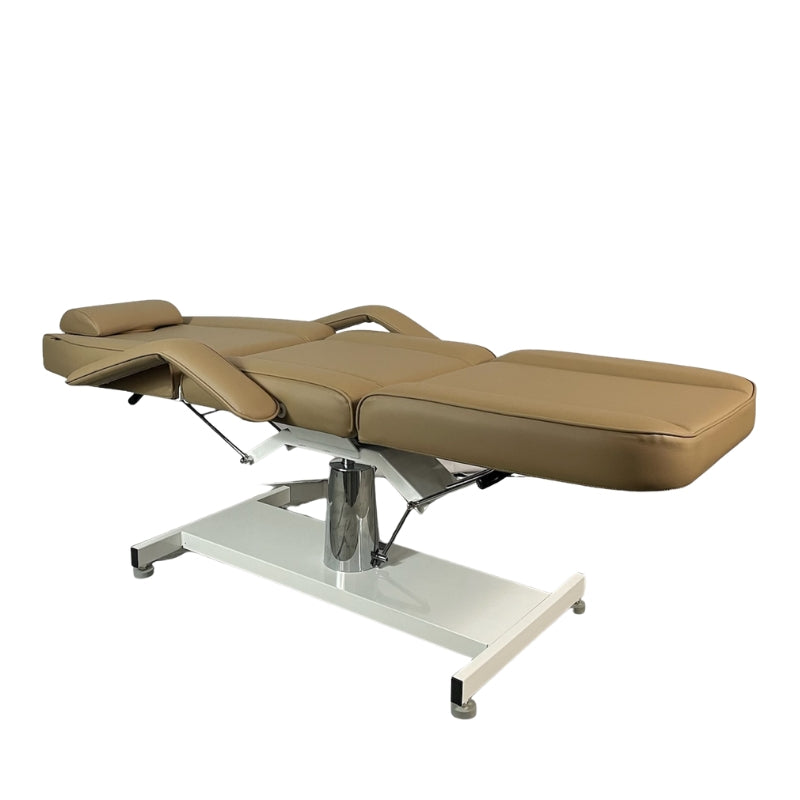 Karma Wellington sand tan beauty bed in flat position with adjustable sections and headrest