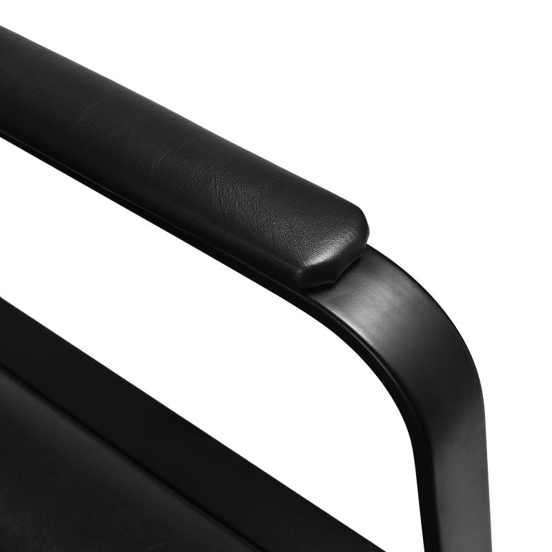 armrest view of black reclining beauty styling chair