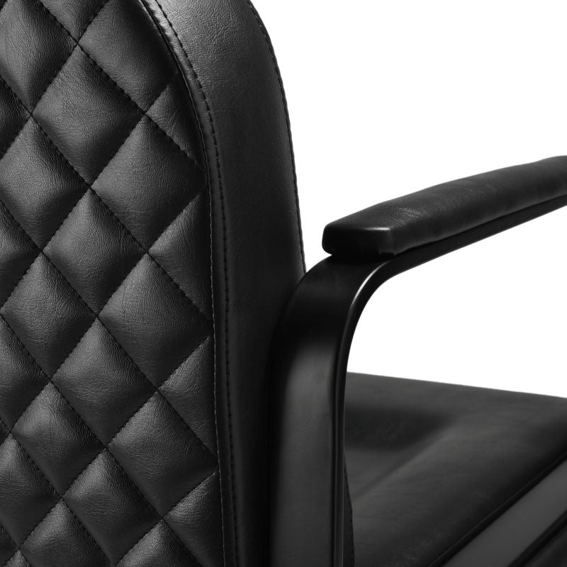 Diamond stitched upholstery detail on salon chair