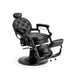 Black barber chair reclined for shaving and grooming services