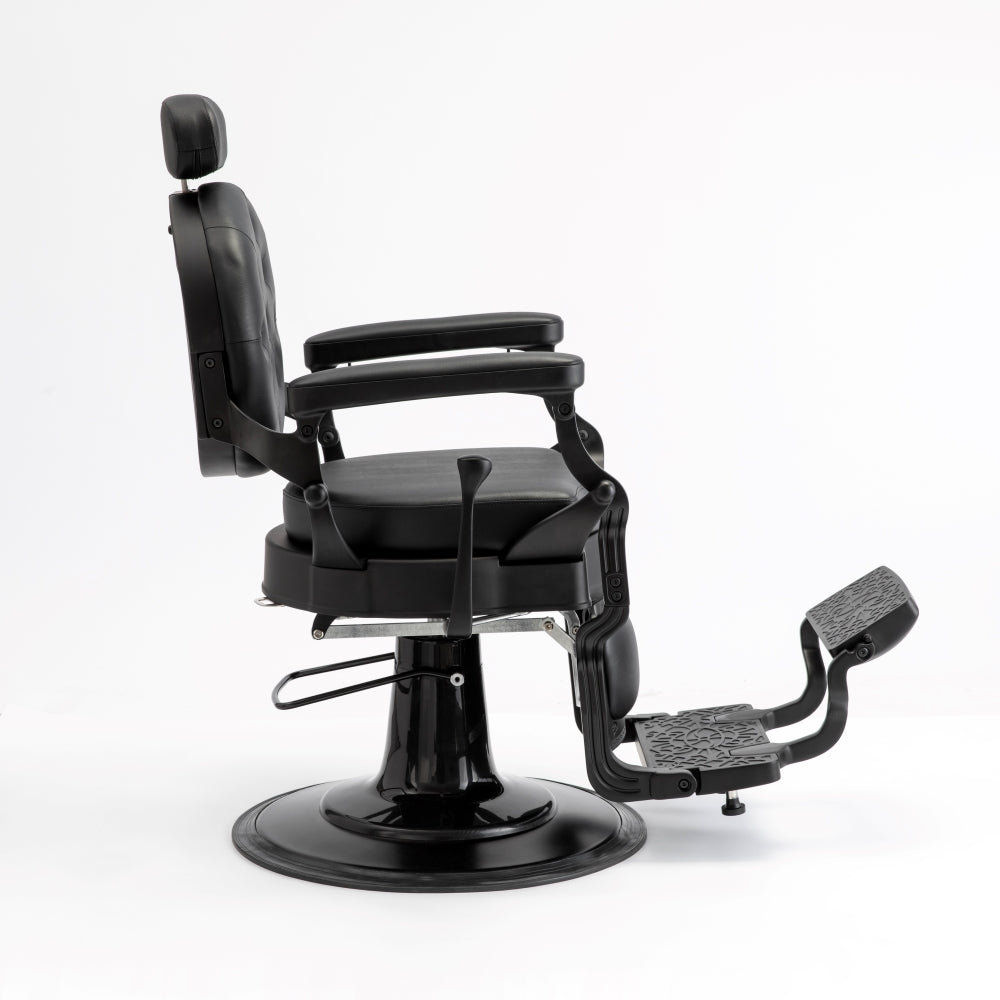 Side profile of black barber chair with reclining backrest