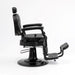 Side profile of black barber chair with reclining backrest