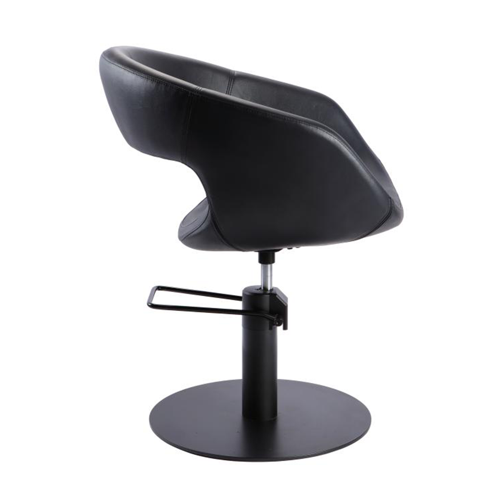 Side view of Mia salon styling chair showing ergonomic seat and black vinyl upholstery