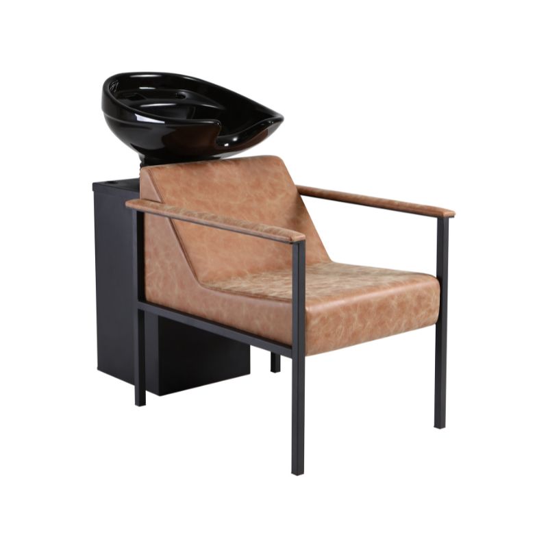 Phoebe hair washing station featuring desert tan vinyl upholstery and a black tilting basin