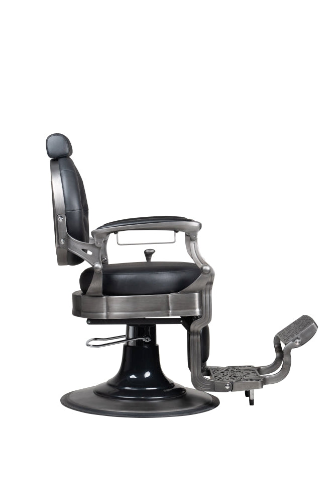 Gun metal barber chair side view showing reclining backrest and footrest