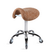 Desert tan saddle stool with chrome base for beauty professionals