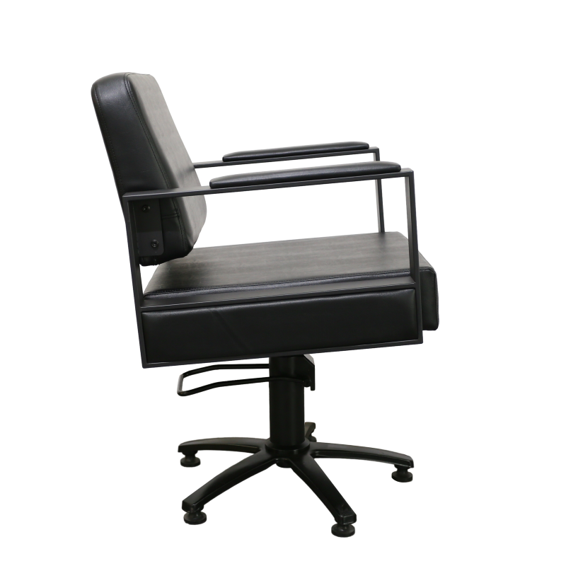 Side view of black salon styling chair with armrests and adjustable height