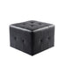 Black vinyl salon ottoman suitable for professional salon seating